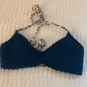 Navy blue crochet bathing suit top.